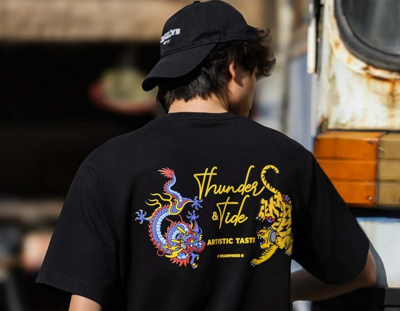 Puff DTF transfer of a colorful bird on a branch, raised full-color print